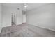 Bright bedroom with neutral carpet, ceiling fan, and doors leading to other rooms at 9389 Meadow Hunt Way, Winter Garden, FL 34787