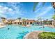 Community pool area including a waterpark, tables, and plenty of seating at 9389 Meadow Hunt Way, Winter Garden, FL 34787