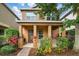 Charming two-story home with a covered front porch and well-maintained landscaping at 9389 Meadow Hunt Way, Winter Garden, FL 34787