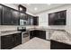 Well-appointed kitchen with dark wood cabinets and stainless steel appliances at 9389 Meadow Hunt Way, Winter Garden, FL 34787