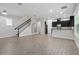 Open-concept living space with modern finishes and hardwood flooring throughout at 9389 Meadow Hunt Way, Winter Garden, FL 34787