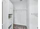 Walk-in closet featuring ample shelving and closet space at 9389 Meadow Hunt Way, Winter Garden, FL 34787