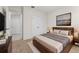 Comfortable bedroom with a king bed, soft lighting, and a view of the hallway at 979 Sun Burst Rd, Winter Haven, FL 33880