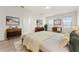 Comfortable bedroom featuring a soft rug, natural light, and tasteful decor at 979 Sun Burst Rd, Winter Haven, FL 33880