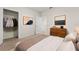 Comfortable bedroom featuring a spacious closet, stylish decor, and neutral tones at 979 Sun Burst Rd, Winter Haven, FL 33880