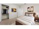 Cozy bedroom featuring a walk-in closet with ample storage and a comfortable bed at 979 Sun Burst Rd, Winter Haven, FL 33880