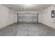 Empty two-car garage ready for customizations like shelves at 979 Sun Burst Rd, Winter Haven, FL 33880