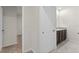 Hallway view showcases bathroom vanity, neutral colors, and leads into additional rooms at 979 Sun Burst Rd, Winter Haven, FL 33880