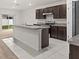 Modern kitchen with granite countertops, stainless steel appliances, and a center island sink at 979 Sun Burst Rd, Winter Haven, FL 33880