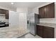 Modern kitchen with granite countertops, stainless steel appliances, and a center island sink at 979 Sun Burst Rd, Winter Haven, FL 33880
