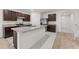 Modern kitchen with granite countertops, stainless steel appliances, and a center island sink at 979 Sun Burst Rd, Winter Haven, FL 33880