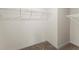 Spacious walk-in closet with carpet flooring and wire shelving for ample storage at 979 Sun Burst Rd, Winter Haven, FL 33880