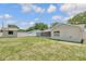 Large yard with white fencing and additional building providing a beautiful view and privacy at 99 Eastridge Dr, Eustis, FL 32726
