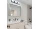 Bathroom featuring a large mirror over the sink with a shower and tub combo at 99 Eastridge Dr, Eustis, FL 32726