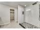 Stylish bathroom featuring glass shower and walk-in closet at 99 Eastridge Dr, Eustis, FL 32726