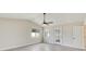 Spacious bedroom boasts bright windows, ceiling fan, and convenient outdoor access at 99 Eastridge Dr, Eustis, FL 32726