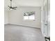 Bright, spacious room with tile floors, a window view, and a door to the outside at 99 Eastridge Dr, Eustis, FL 32726