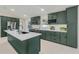 Modern kitchen featuring dark green cabinetry, a center island, stainless appliances, and lots of natural light at 99 Eastridge Dr, Eustis, FL 32726