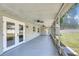 Covered patio with ceiling fans perfect for outdoor enjoyment at 99 Eastridge Dr, Eustis, FL 32726