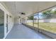 Covered patio provides shade with a view of the backyard at 99 Eastridge Dr, Eustis, FL 32726