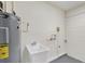 Utility room features a sink and water heater at 99 Eastridge Dr, Eustis, FL 32726