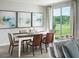 Elegant dining area with stylish furnishings and a large window with a view of the outdoors at 1110 Cumberland Trail Dr, Lake Hamilton, FL 33851