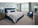 Serene bedroom featuring neutral colors, plush bedding, and scenic outdoor views at 1122 Cumberland Trail Dr, Lake Hamilton, FL 33851
