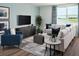 Cozy living room with comfortable seating, contemporary décor, and views of a nearby lake at 1122 Cumberland Trail Dr, Lake Hamilton, FL 33851