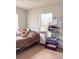 Bedroom featuring a comfortable bed, natural light, and ample space for personalized decor at 1150 Jackson St, Oviedo, FL 32765