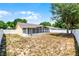 Backyard featuring a large screened lanai and a privacy fence at 117 Clowson Ct, Ocoee, FL 34761