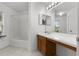 Bright bathroom features a shower-over-bath and white countertops at 117 Clowson Ct, Ocoee, FL 34761