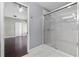 Well-lit bathroom with a glass-enclosed shower and access to bedroom at 117 Clowson Ct, Ocoee, FL 34761