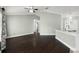 Spacious living room with hardwood floors leads to the kitchen area and other rooms at 117 Clowson Ct, Ocoee, FL 34761