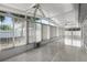 Sunroom with tile floor, ceiling fans, and plentiful natural light at 117 Clowson Ct, Ocoee, FL 34761