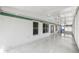 Spacious, enclosed sunroom with tile flooring and multiple windows at 117 Clowson Ct, Ocoee, FL 34761