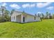 Expansive backyard with a well-maintained lawn, offering plenty of space for outdoor activities at 12197 Sw 76 Ln, Dunnellon, FL 34432