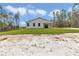Spacious backyard with lush green grass, offering a serene and private outdoor space at 12197 Sw 76 Ln, Dunnellon, FL 34432