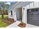 Inviting front porch with stylish detailing, perfect for relaxing outdoors, and modern curb appeal at 12197 Sw 76 Ln, Dunnellon, FL 34432