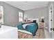 Bright bedroom with a comfortable bed, stylish nightstands, and a cozy ambiance, perfect for relaxation at 12197 Sw 76 Ln, Dunnellon, FL 34432