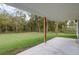 Covered patio overlooks expansive backyard at 12460 Sw 48 Lane Rd, Ocala, FL 34481