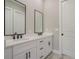 Bathroom featuring a double vanity with quartz countertop and black hardware at 12460 Sw 48 Lane Rd, Ocala, FL 34481