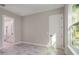 Bright bedroom with wood-look tile flooring and an ensuite bathroom at 12460 Sw 48 Lane Rd, Ocala, FL 34481