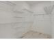 Walk-in closet features wood-look tile floors and wire shelving at 12460 Sw 48 Lane Rd, Ocala, FL 34481