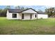 Exterior back elevation of home with large backyard at 12460 Sw 48 Lane Rd, Ocala, FL 34481