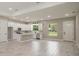 Spacious kitchen with white cabinetry, stainless appliances, and a large center island at 12460 Sw 48 Lane Rd, Ocala, FL 34481