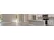 Modern kitchen featuring white cabinets, stainless steel appliances and a large island at 12460 Sw 48 Lane Rd, Ocala, FL 34481