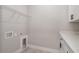 Practical laundry room with modern countertops and a convenient wire shelving unit at 12460 Sw 48 Lane Rd, Ocala, FL 34481