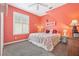 Cozy bedroom featuring bright walls, plush carpet, a ceiling fan, and a comfortable queen bed at 13524 Glynshel Dr, Winter Garden, FL 34787