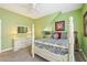 Inviting bedroom with a four-poster bed, wall art, and soft carpet for a cozy retreat at 13524 Glynshel Dr, Winter Garden, FL 34787