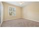 Comfortable bedroom featuring neutral carpet, a window with shutters, and ample natural light at 13524 Glynshel Dr, Winter Garden, FL 34787